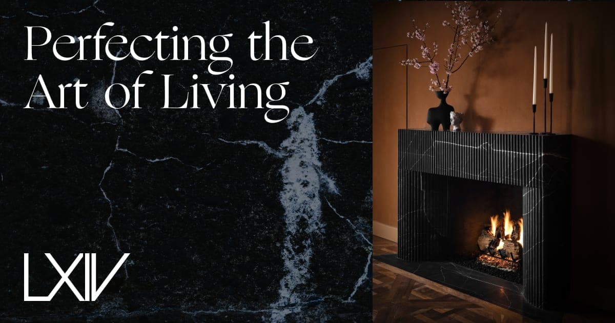 LXIV brand lockup over black marble, beside a fluted marble fireplace, with the line "Perfecting the Art of Living"
