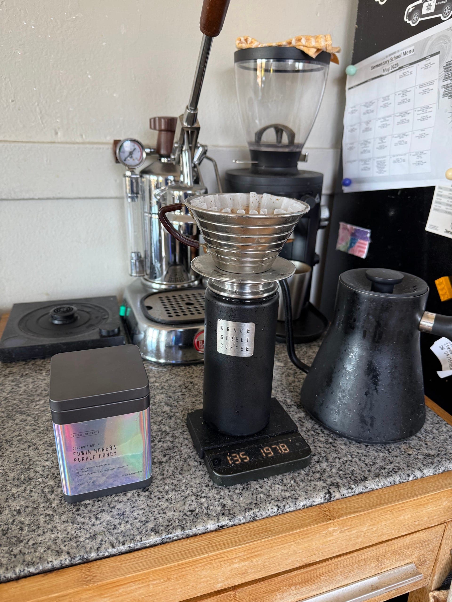 Coffee brewing through a dripper onto a Grace Street Coffee tumbler